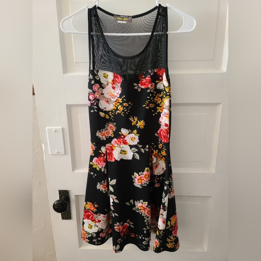 Above knee length sleeveless cocktail dress with see thru mesh neckline